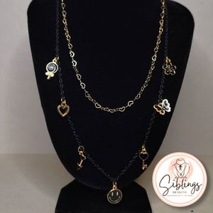 Necklace with black and golden charms